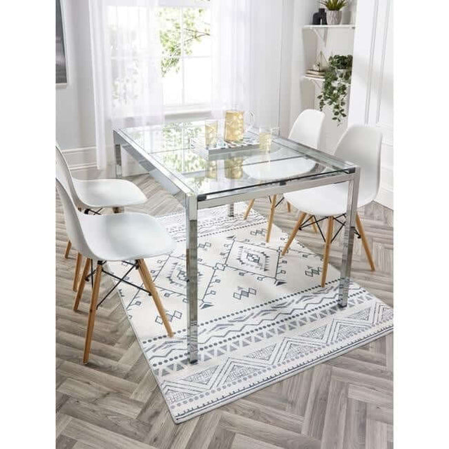 Stylish Washable Rug with Geometric Patterns Under a Glass Dining Table and Modern Chairs