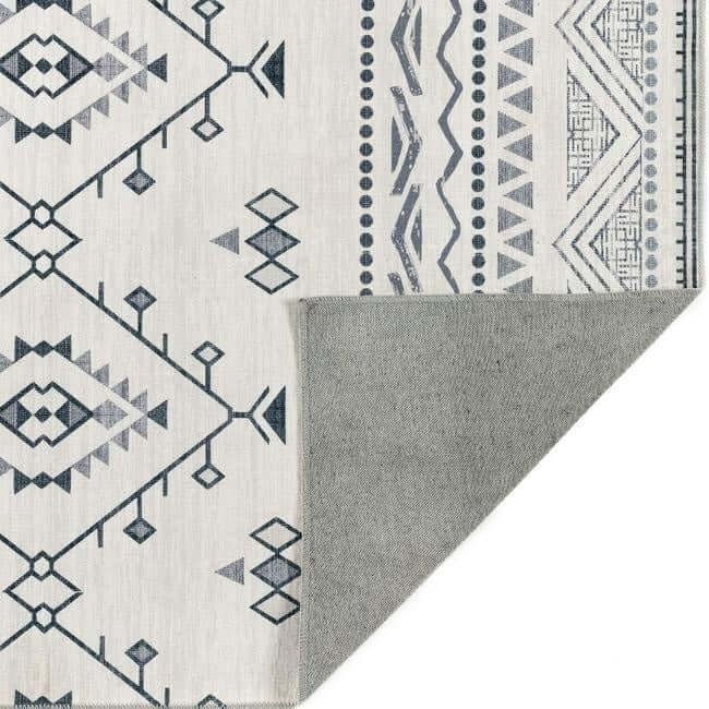 Stylish beige washable rug with geometric patterns and a soft grey backing for versatile home decor
