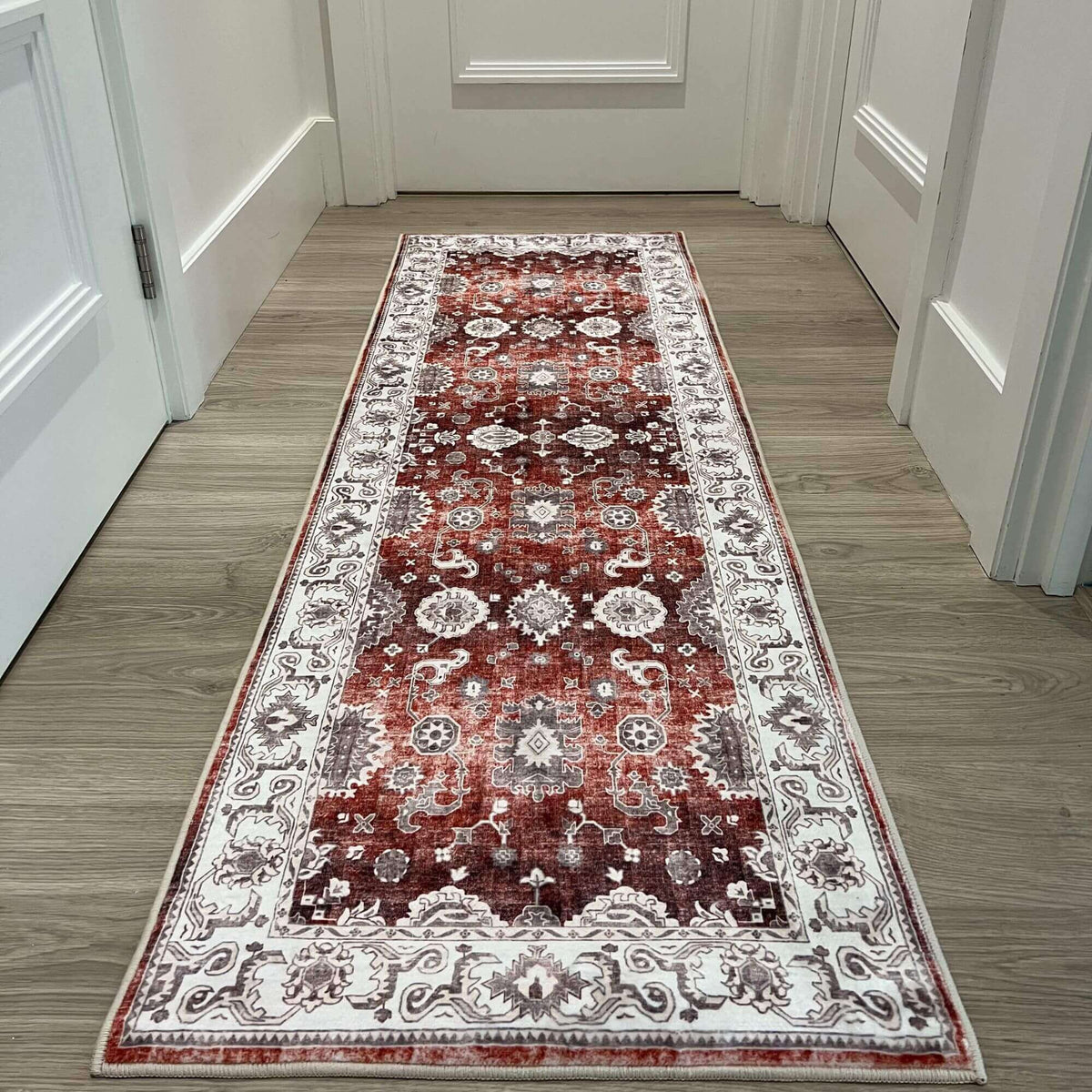 Elegant patterned washable rug in rich red tones, perfect for adding style to any hallway