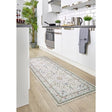 Elegant washable rug in a kitchen setting, featuring a floral pattern and durable construction