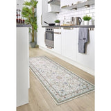 Elegant washable rug in a kitchen setting, featuring a floral pattern and durable construction