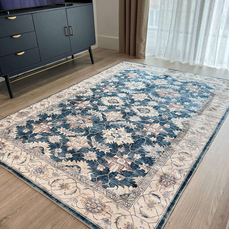 Elegant washable rug with intricate floral patterns in blue and beige for home decor