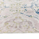 Soft and stylish washable rug with intricate patterns in neutral tones and blue accents