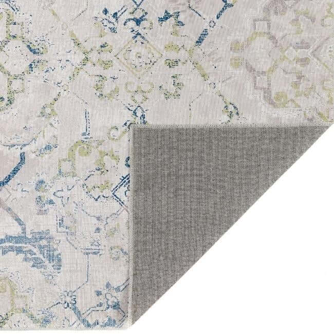 Stylish washable rug with intricate patterns in blue and green tones, perfect for modern homes