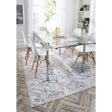 Stylish washable rug under a glass dining table with white chairs, perfect for modern interiors
