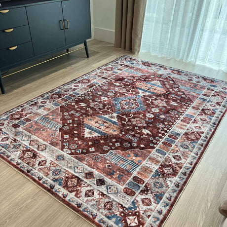 Vintage-style washable rug in rich maroon and intricate patterns, ideal for home decor
