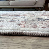 Close-up of a textured Washable Rug with intricate patterns, placed in a stylish living room setting