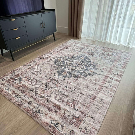 Elegant patterned washable rug in soft hues, enhancing contemporary living space beside a stylish cabinet