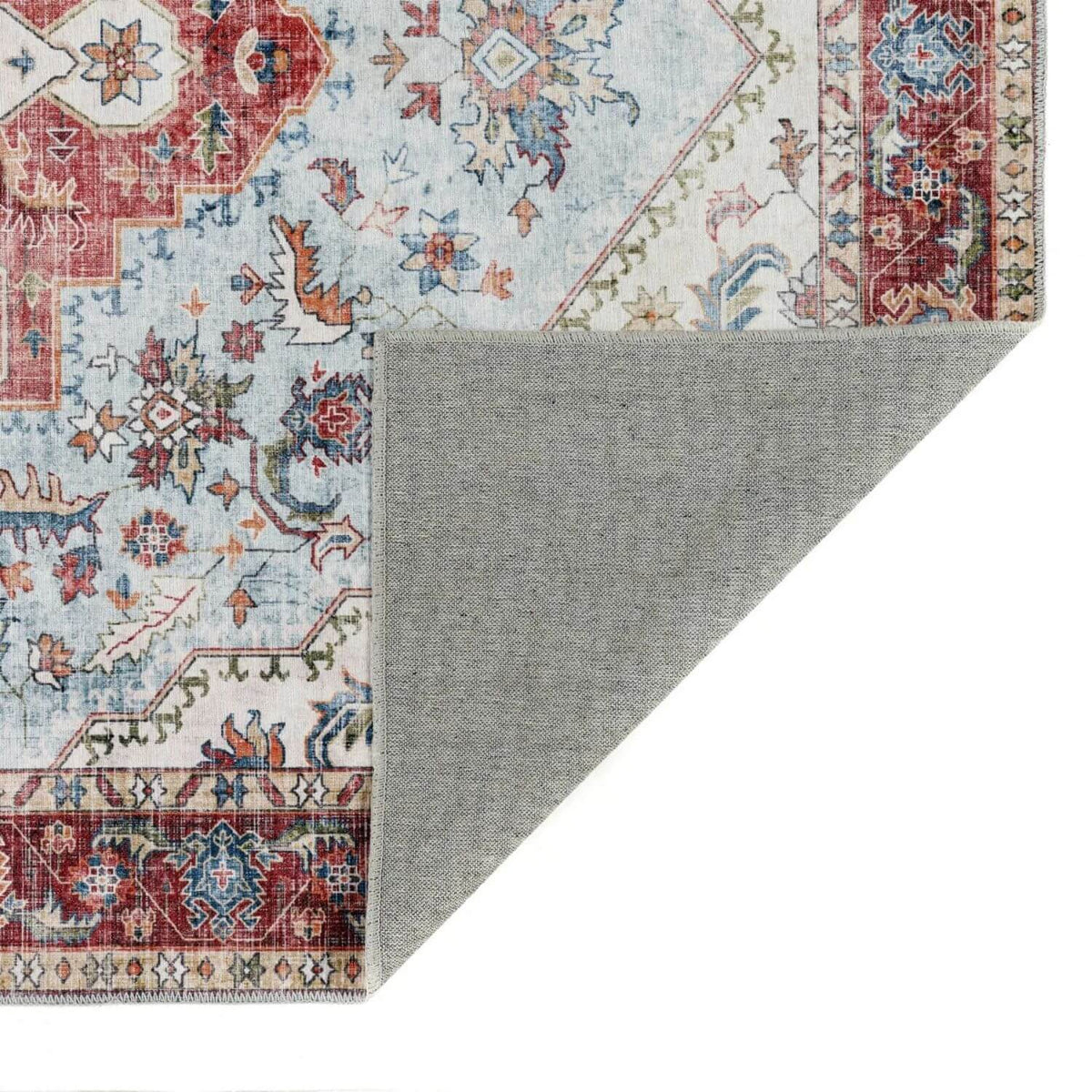 Elegant washable rug with intricate floral patterns in blue and red, perfect for adding style to any room