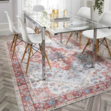 Elegant washable rug under glass dining table and chairs, adding warmth to the modern interior
