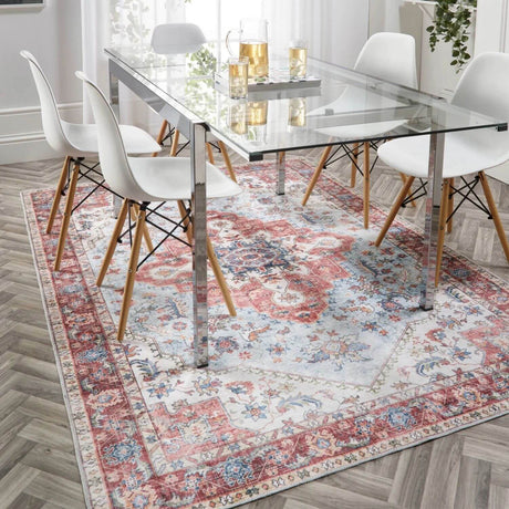Elegant washable rug under glass dining table and chairs, adding warmth to the modern interior