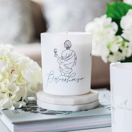 Stylish Wax Glass Candle featuring elegant design and floral accents for home decor