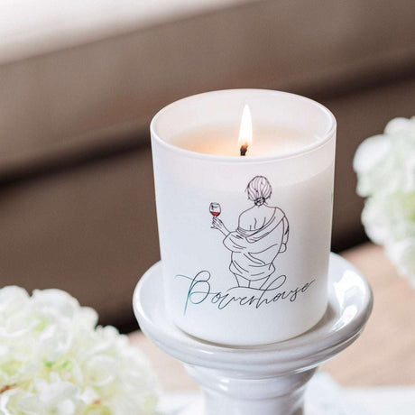 Avalon Home UK Wax Glass Candle with elegant design and flickering flame in a stylish setting