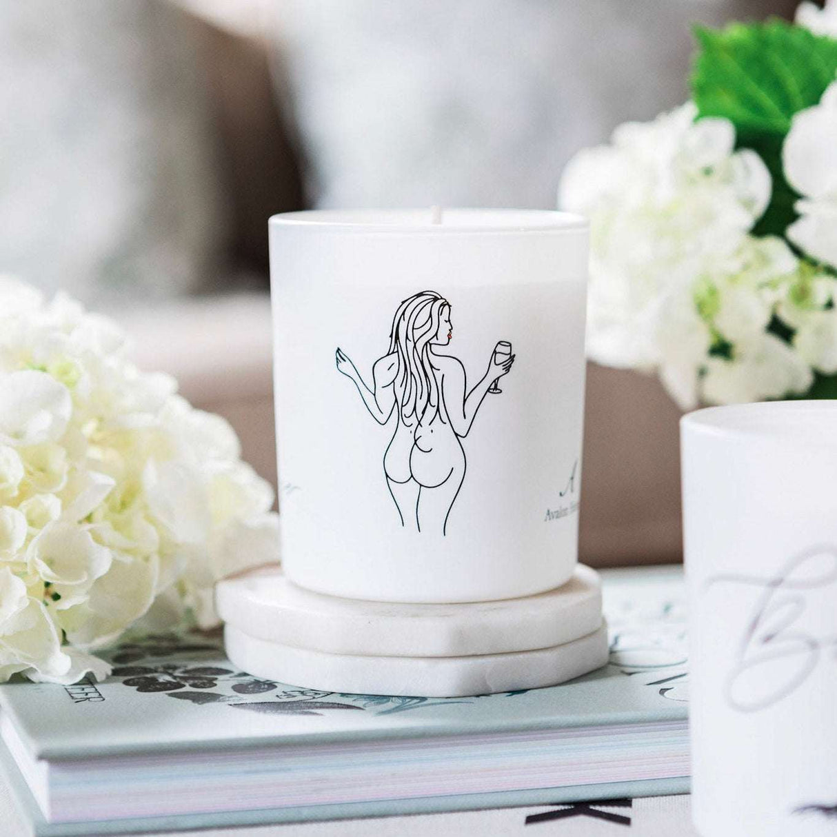 Avalon Home UK Wax Glass Candle featuring a minimalist design with a figure illustration