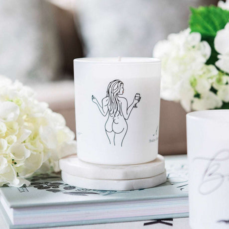 Avalon Home UK Wax Glass Candle featuring a minimalist design with a figure illustration