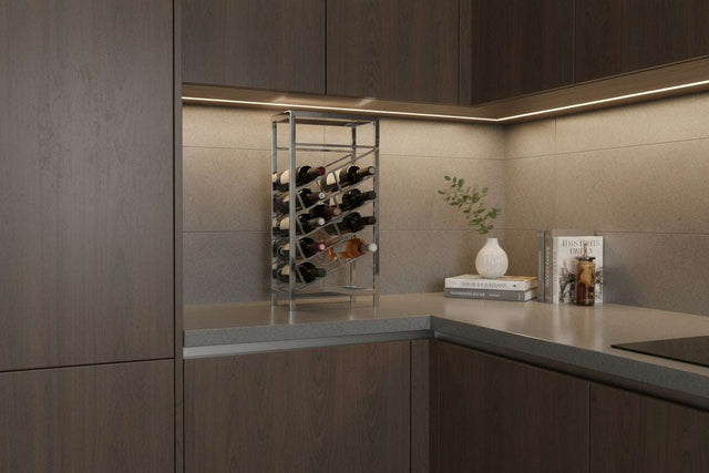Orsina Wine Rack displayed in modern kitchen corner with glassware and decorative plants