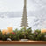 Elegant tree on stand decoration with white candles and festive greenery for Christmas room decor