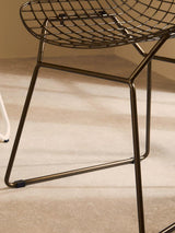 Orsina Wire Chair featuring a modern design with a sturdy wire frame for outdoor seating