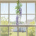 Artificial Wisteria Spray hanging in a sunny window, adding a touch of floral elegance to home decor