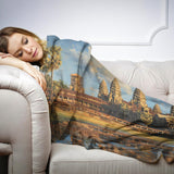 HOME ART HAVEN Throw Blanket featuring a serene landscape design with a woman relaxing on a sofa