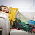 Colourful HOME ART HAVEN throw blanket featuring a vintage train design, perfect for cosy relaxation