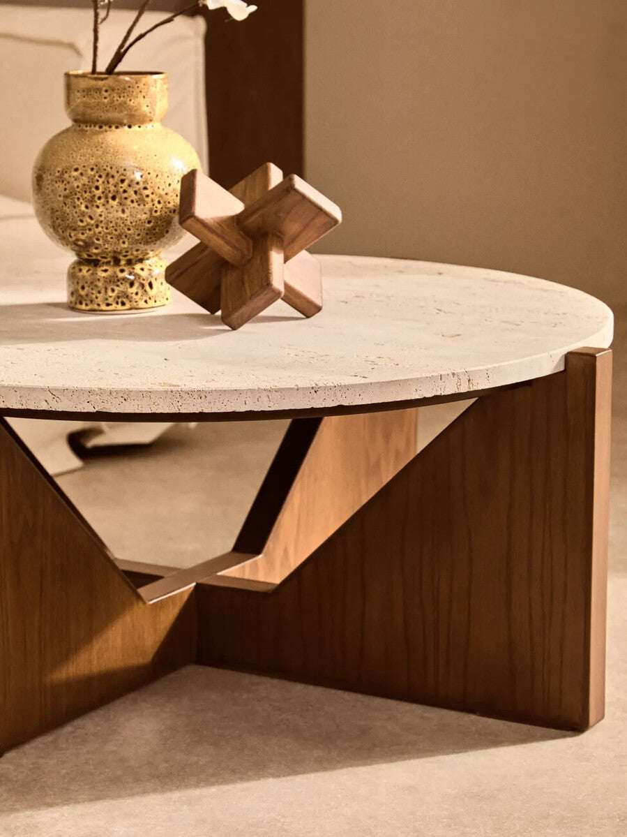 Elegant wood sculpture accentuated by a stylish coffee table setting with a decorative vase