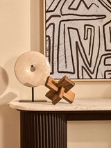 Stylish Wood Sculpture by Orsina on a modern side table with decorative stone ornament