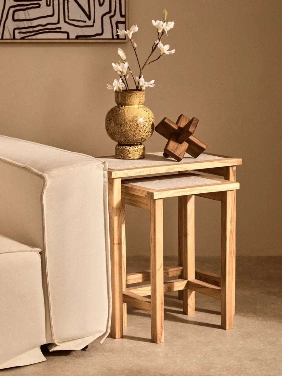 Orsina Wood Sculpture displayed on a wooden side table with decorative vase and flowers
