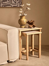 Orsina Wood Sculpture displayed on a wooden side table with decorative vase and flowers