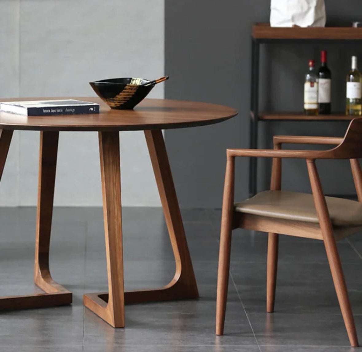 Modern Nisu Home Dining Table in a round design with wooden finish and stylish legs
