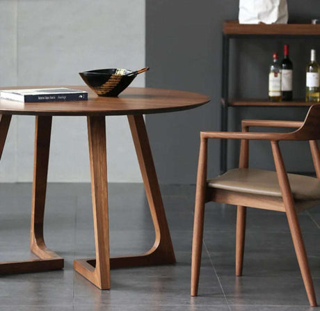 Modern Nisu Home Dining Table in a round design with wooden finish and stylish legs