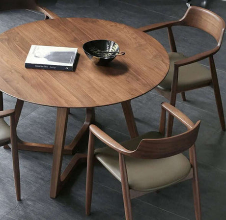 Elegant Nisu Home Dining Table with a round wooden top and stylish chairs for modern interiors