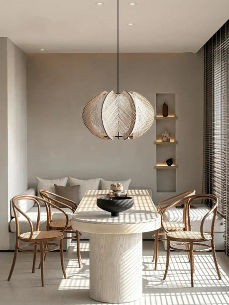 Stylish Pendant Light in a modern dining area with a round table and elegant chairs