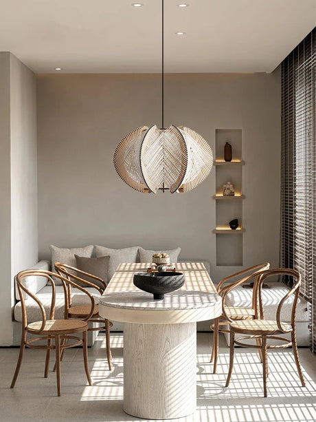 Stylish Pendant Light in a modern dining area with a round table and elegant chairs