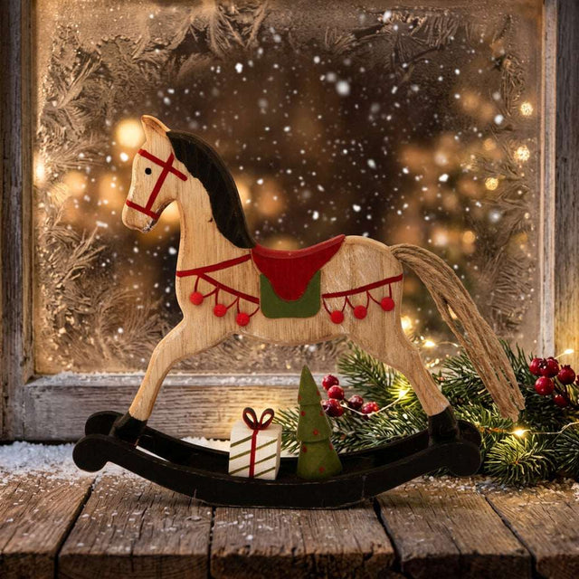 Wooden rocking horse Christmas room decoration with festive details and snow-covered background