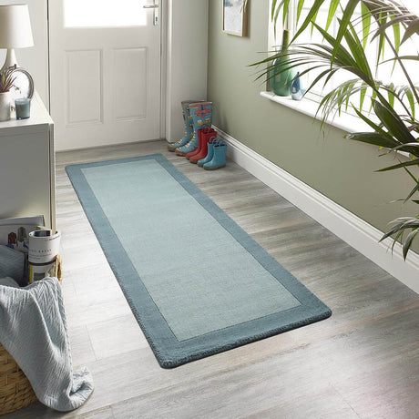 Stylish wool rug in light blue, perfect for enhancing hallways and adding warmth to your home