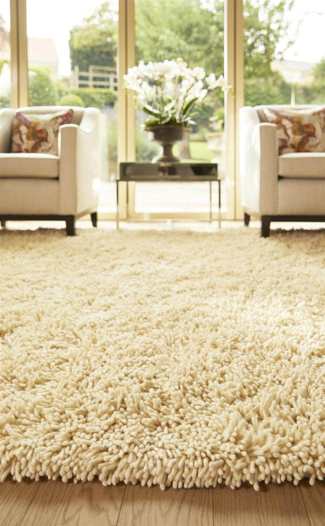 Luxuriously soft wool rug in creamy white, perfect for enhancing living room aesthetics
