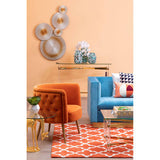 Orsina Woven Rug in vibrant orange and geometric pattern, enhancing modern living room decor