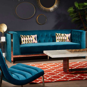 Stylish Woven Rug in red and white, enhancing a modern living room with teal furniture and decorative accents
