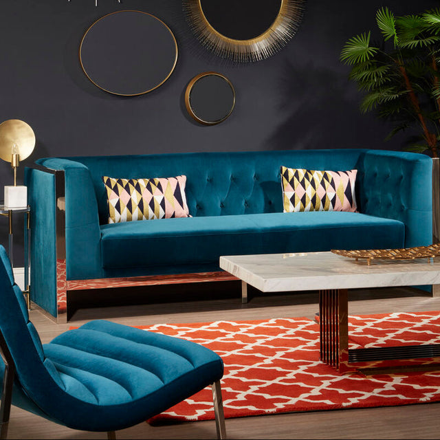 Stylish Woven Rug in red and white, enhancing a modern living room with teal furniture and decorative accents