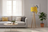 Modern lampshade in yellow honeycomb pattern on a wooden floor lamp in a bright living room